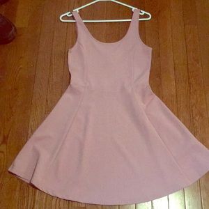 Light pink fitted dress with flared skirt